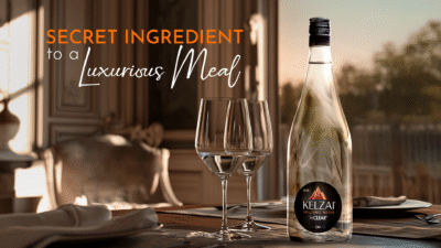 Elegant glass bottle of Kelzai volcanic alkaline water served at a luxury Indian dining table
